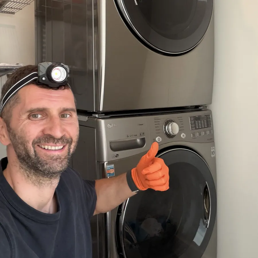 Technician servicing a dryer in Carmel Valley